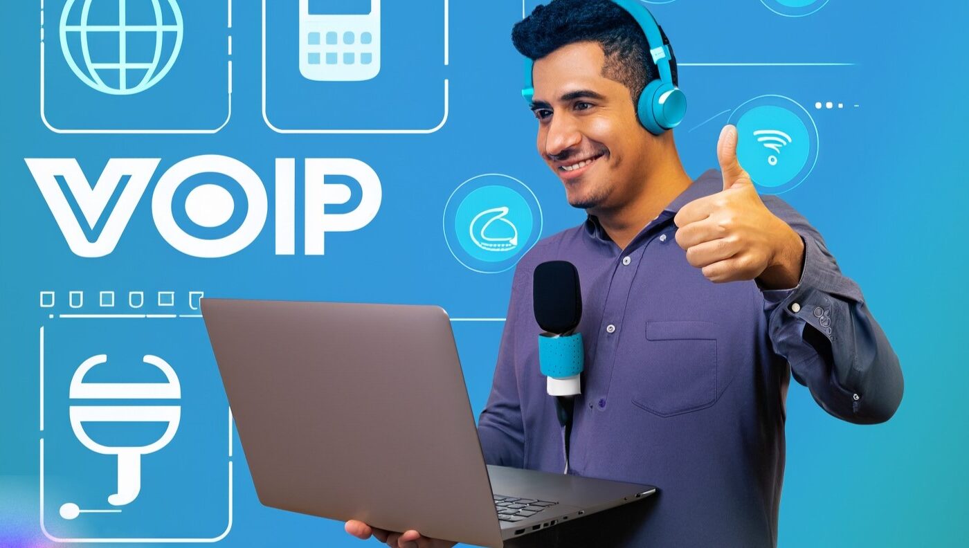 A person wearing headphones and holding a microphone in front of a laptop with a VoIP logo on the screen. The person has a confident smile and a thumbs up gesture. The background is blue with some icons related to VoIP technology, such as phones, routers, cables, etc.